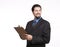 Smiling young businessman with a clipboard looking away