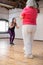 Smiling young Caucasian dance teacher doing rhythm clapping