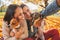 Smiling young couple with dogs outdoors making selfie