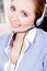 Smiling young female callcenter agent with headset