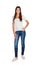 Smiling young girl with jeans standing