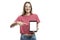 A smiling young girl points a finger at an isolated screen tablet. Space for text. Front view. White background