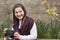 Smiling Young Little Girl Is Strapped an Analogue Camera on Her