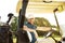 Smiling young male golfer sitting in a golf cart