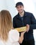 Smiling young man delivering pizzas at home