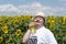 Smiling and young man with down syndrome whio happy with sunflower oil