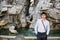 Smiling young man in front of fountain in Navona Square, Rome