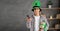 smiling young man in leprechaun hat holding gift box, using mobile phone, St.Patrick's day promotion sale app on