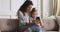 Smiling young mother making selfie photo with daughter.