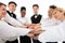 Smiling Young Restaurant Staff Stacking Hands