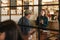 Smiling young waitress talking with a bistro customer