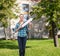 Smiling young woman with arrow poiting up