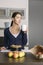 Smiling young woman baking apple tart