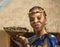 Smiling young woman Bantu nation serving eatable caterpillars for dinner. South Africa.