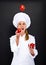 Smiling young woman chef with tomatos juggle