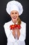 Smiling young woman chef with tomatos juggle