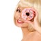 Smiling young woman with colorful donut isolated