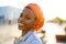 Smiling young woman enjoying the outdoors at sunset