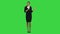Smiling young woman in formal wear talking to camera and gesturing on a Green Screen, Chroma Key