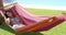 Smiling young woman laying down in hammock