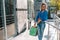 Smiling young woman posing with a handful of shopping bags. Shopping concept