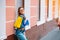 Smiling young woman posing with a handful of shopping bags. Shopping concept