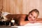 Smiling young woman relaxation in spa salon