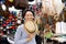 Smiling young woman at shopping market