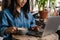 Smiling yuong african woman working on laptop