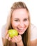 Smilling girl with green juicy apple