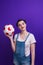 Smilling girl holding a soccer ball over isolated blue wall at studio