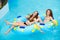Smilng women in bikini riding at the water slide in the aqua park