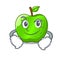 Smirking character ripe green apple with leaf