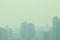 Smog city in summer, haze of pollution covers city, global warming concept