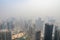 smoggy day, with view of bustling cityscape and towering skyscrapers