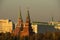 Smoggy sky over Moscow Kremlin towers. Golden light of autumn evening.