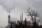 Smoggy smoky power generator station on grey day