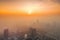 smoggy sunrise over polluted city skyline