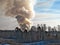 Smoke billowing from a controlled fire at a landfill site in winter in Minnesota