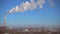 Smoke from the chimney of factory and blue sky, power station.