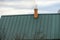 Smoke from the chimney, heating. smoke billowing. coming out of a house chimney against a blue sky background