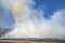 Smoke Clouds Rising ih the Heat of a Prairie Fire