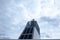 Smoke coming out of a chimney on a ferry with blue sky and moody clouds as a background. Toxic gas, environmental responsibility,