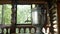 Smoke from the cover of a traditional Russian samovar on the veranda of a wooden house in the forest