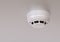 Smoke detector isolated on the ceiling of modern house with smart system