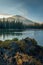 Smoke from distant wildfires 2020 surround Mt. Bachelor in Oregon. Tent at shoreline.