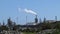 Smoke escaping from a smokestack at an oil refinery in Los Angeles