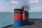 Smoke from ferry boat flue during sea with sunlight, sea water and blue sky in background, Thailand