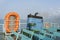 Smoke from ferry boat flue during sea with sunlight, sea water and clear sky in background, Thailand