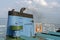 Smoke from ferry boat flue during sea with sunlight, sea water and clear sky in background, Thailand